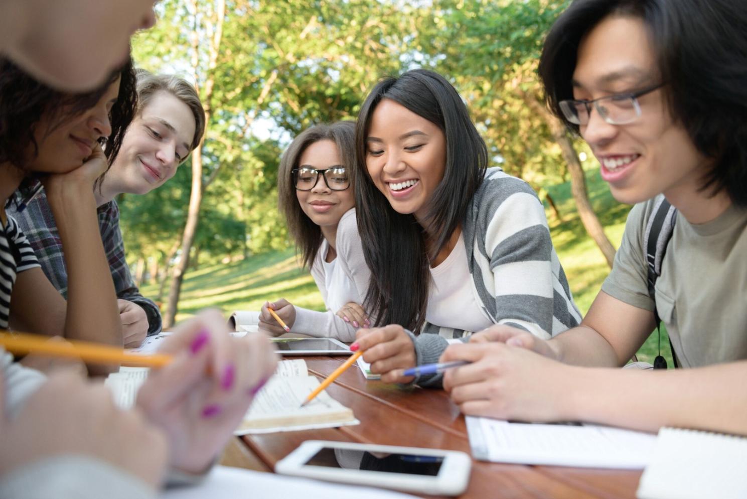 Team meeting planning upcoming financial education workshops and community programs