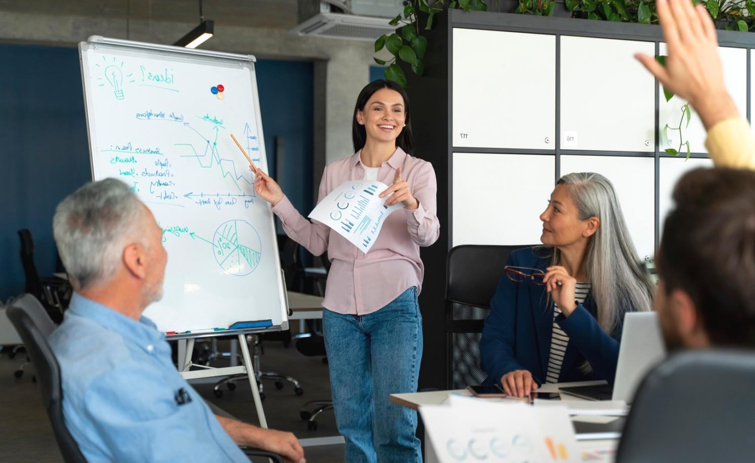 Students reviewing financial planning materials with calculators and charts
